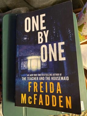 One by One - Blue Paperback Thriller by